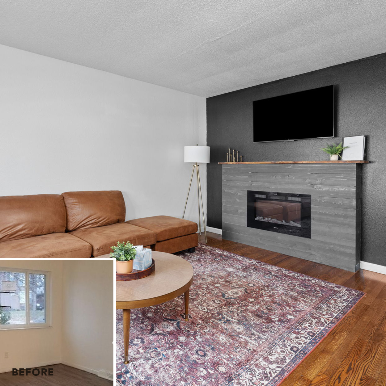 A living room with fireplace, couch, and rug